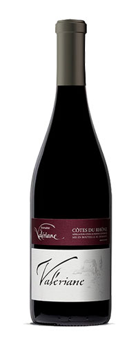 Domaine de la Valériane. Côtes du Rhône Red wine. The color is deep, a deep red with purple undertones. The aromas of red fruits and spices are found in the mouth on a full and round wine.